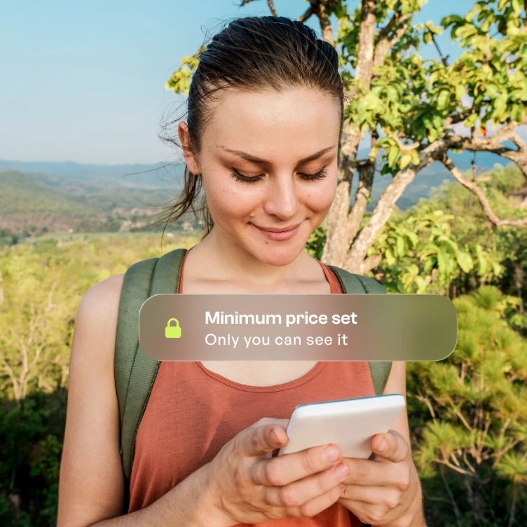 Seller setting a private minimum price on her phone